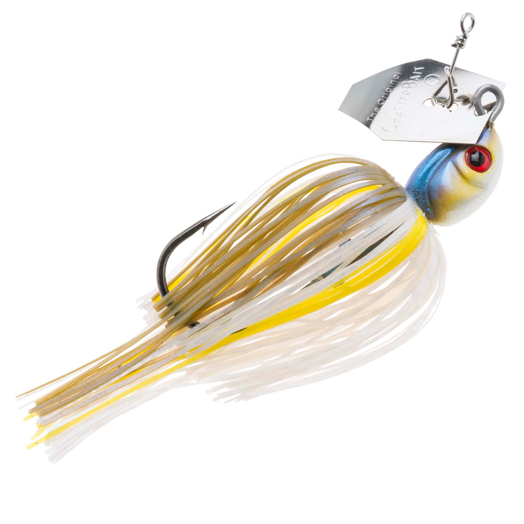 Chatterbait fishing lure with white skirt and yellow strands, silver-blue head with red eye.