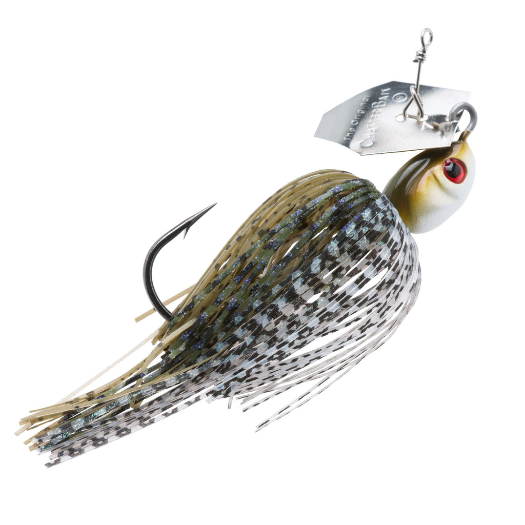 Dark-speckled silver chatterbait lure with red eye and metal-flecked skirt