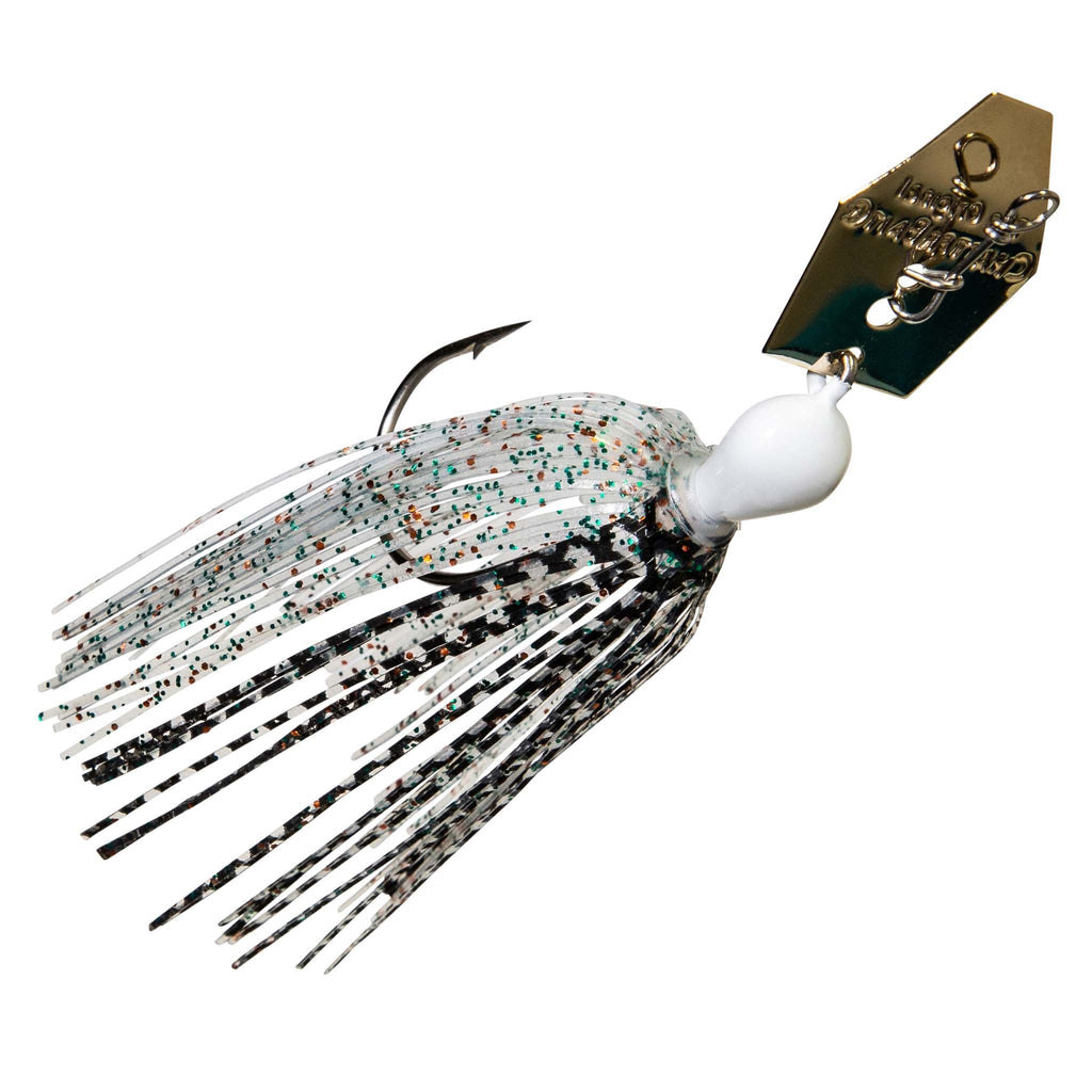 Black-and-white chatterbait lure with white skirt and speckled strands, gold blade