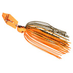 Chatterbait lure with bright orange skirt strands, black-green head, and spinner blade.