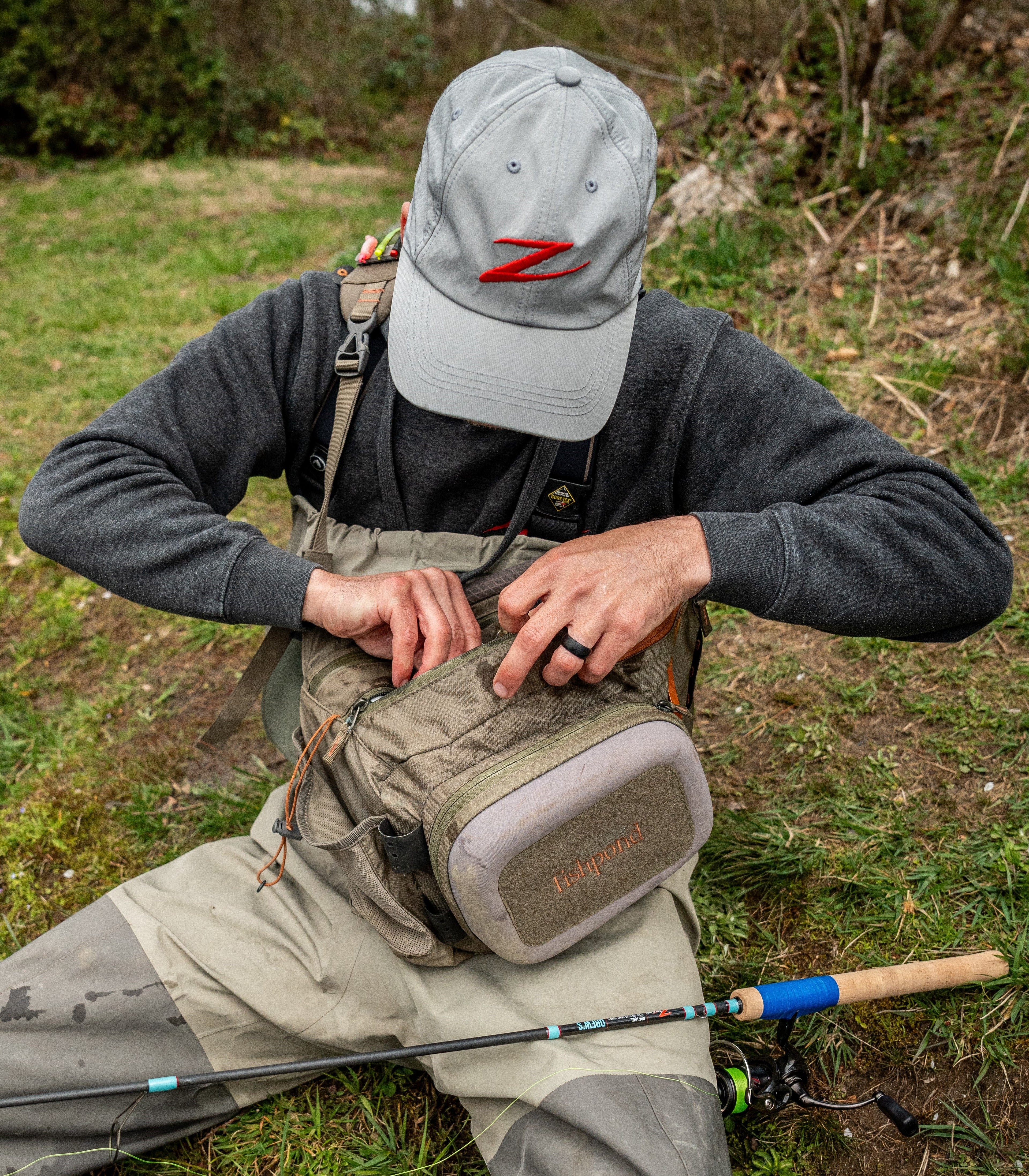 Light gray baseball cap with red Z logo embroidery, worn with curved brim
