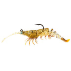 Gold shrimp-style fishing lure with speckled glitter body, black hook, orange tail fin