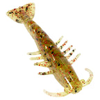 Golden soft plastic shrimp lure with red speckles, translucent body, paddle tail and legs