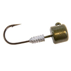 Green pumpkin jig head lure with bucktail skirt, barbed hook and sparkly textured head.