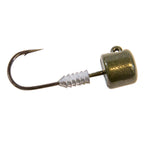 Green pumpkin jig head lure with bucktail skirt, barbed hook and gold-sparkle head.